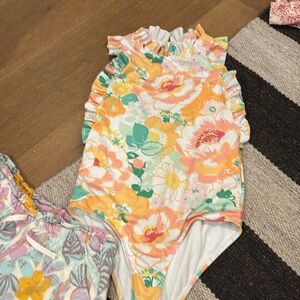 Janie and Jack swimsuit and Cat and Jack shorts. Both like new. Beautiful
